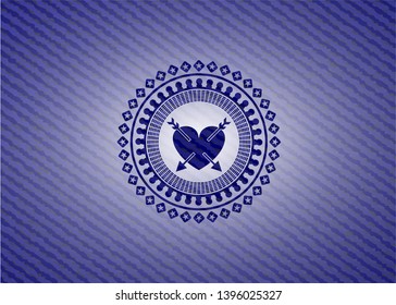 heart with two arrows icon inside emblem with jean texture