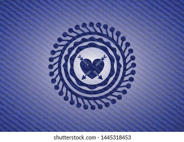 heart with two arrows icon inside denim background