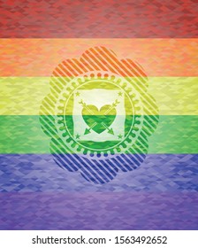 heart with two arrows icon inside emblem on mosaic background with the colors of the LGBT flag