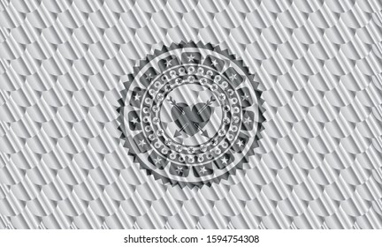 heart with two arrows icon inside silver badge. Scales pattern. Vector Illustration. Detailed.
