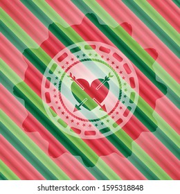 heart with two arrows icon inside christmas badge.