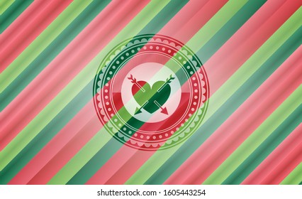 heart with two arrows icon inside christmas emblem.
