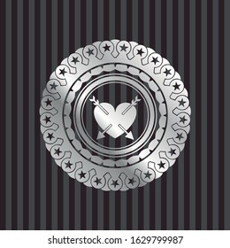 heart with two arrows icon inside silver shiny badge
