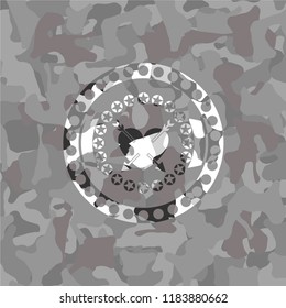 heart with two arrows icon on grey camouflage pattern