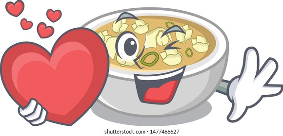 With heart wonton soup in a cartoon bowl