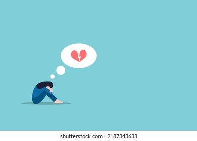 Heartbroken woman sitting on floor and alone. Ending relationship and sorrow concept.