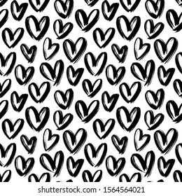 Hearts black and white vector seamless pattern. Freehand love symbol illustrations on white background. Hand drawn hearts grunge style textile print. Saint Valentines day wrapping paper design