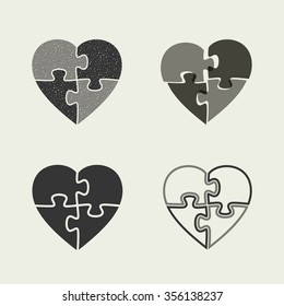 Hearts icons with puzzle. Four puzzle icons in the shape of heart.