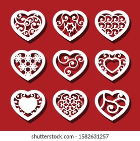 Hearts on the red background for laser cutting. Set of white ornamental hearts