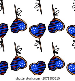 a heart-shaped candy pattern with icing with the symbols of the US flag. a doodle-style festive treat on a stick with icing white stars on a blue background and red and white stripes arranged 