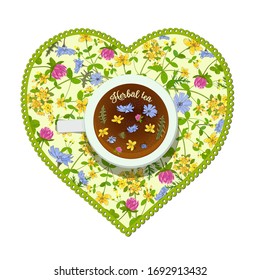 Heart-shaped cup with herbal tea on a floral napkin