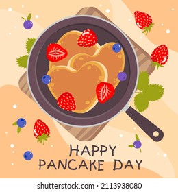 Heart-shaped pancakes in a frying pan with berries. Vector clipart.