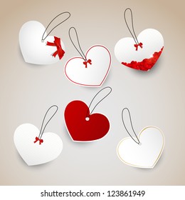 Heath shape tags red and white width bows and small hearts.