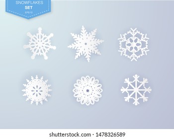 Heavy snowfall, snowflakes in different shapes and forms, vector illustration. Many white cold flake elements isolated on transparent background. White snowflakes flying in the air.