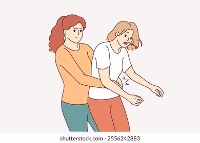 Heimlich technique is demonstrated by woman saving friend who was choking and pressing on stomach to restore breathing. Girl provides first aid and uses heimlich technique to avoid harm to health.