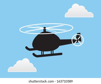 Helicopter silhouette in the sky with clouds 