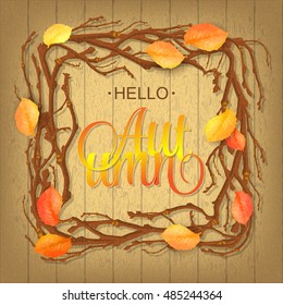 Hello Autumn Background. Bright autumn branch and leaves on wood background. Hello autumn lettering