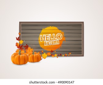 Hello Autumn Background. Bright autumn leaves and pumpkins with wooden board background.  You can place your text in the center.