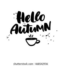 Hello Autumn. Fall vector lettering with cup of tea and ink splashes. Seasonal isolated handwritten quote. Modern brush calligraphy. Hand lettering for posters, invitations, cards, t shirt