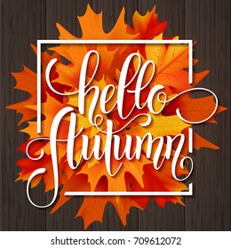 Hello Autumn hand drawn lettering. Yellow leaves background. Vector illustration EPS10.