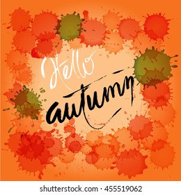 Hello autumn. Hand painted brush lettering on watercolor background.