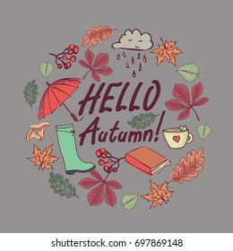 Hello autumn hand written inscription with maple leaves, an umbrella, a book and clouds. Vector card