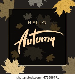 Hello Autumn handwritten greeting card with orange maple leafs on black background.