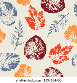 Hello Autumn. Leaf fall. Seamless autumn pattern from different leaves. Warm colors. Orange, yellow, gray, brown on light background.