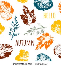 Hello Autumn. Leaf fall. Seamless autumn pattern from different leaves. Warm colors. Orange, yellow, green, gray, brown on white. Isolated on white background.