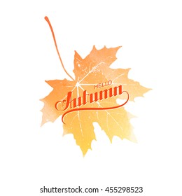 Hello Autumn. Seasonal vector illustration of handwritten Hello Autumn label on watercolor maple leaf. Autumn lettering composition