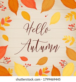 Hola, otoño. Plantilla de otoño en un marco de hojas y bayas y una inscripción en un fondo de madera clara.