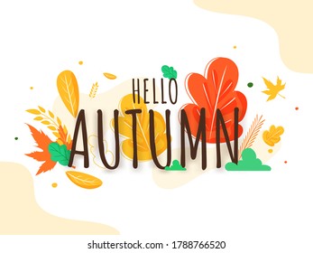 Hello Autumn Text On Colorful Leaves Decorated Background.