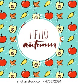 Hello autumn text in round frame on the fall pattern with red apples and orange leaves