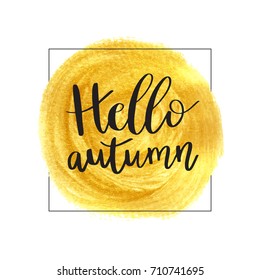 Hello Autumn. Vector illustration of lettering phrase on golden paint stain banner. Vector gold paint. Autumn calligraphy composition with gold brush painted textured stain.