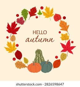 Hello autumn wreath with colorful fall leaves, berries and pumpkins