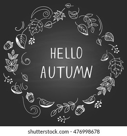 "Hello, autumn". Wreath with doodle style leaves on black background