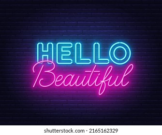 Hello Beautiful neon lettering on brick wall background.