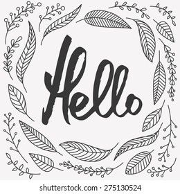 Hello calligraphic lettering with outline hand drawn leaves, twigs, berries around