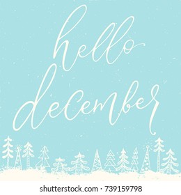 Hello December calligraphy inscription with winter snowfall forest