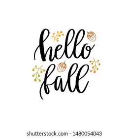 Hello fall hand lettering phrase with berries, acorns and maple leaf background