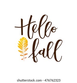 Hello fall hand written inscription with orange leaf on white background