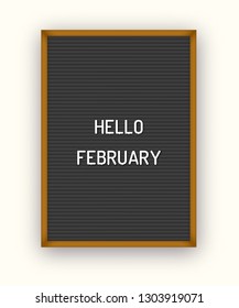 Hello February motivation quote on black letterboard with white plastic letters