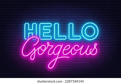 Hello Gorgeous neon quote on brick wall background.
