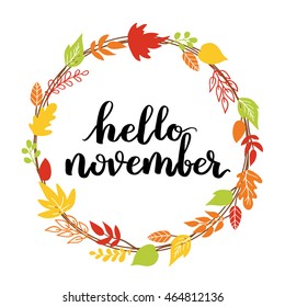 Hello, November. The trend calligraphy. Beautiful round wreath of autumn leaves. Vector illustration on a blue background.