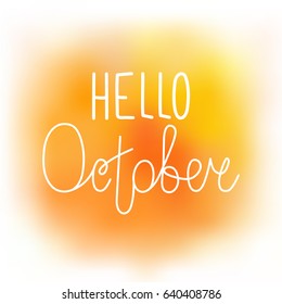 Hello october, elegant greeting card with hand-written curled line lettering on blurred wet orange and yellow paint stains background. Mesh tool watercolor imitation with text greeting to october.