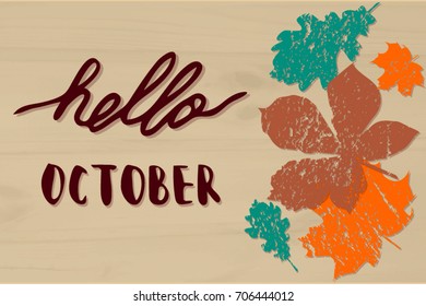Hello October. Hand drawn lettering on textured background with colorful  leaves.
