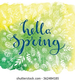 Hello, Spring. Card template with modern calligraphy and hand drawn leaves and flowers on watercolor background. Handwritten ink lettering.