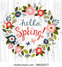 Hello spring greeting card. Hand drawn illustration with wood background effect.  Flower wreath and  lettering.