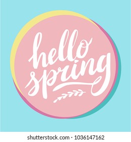 Hello Spring, hand drawn calligraphy and lettering. Design for holiday greeting and seasonal spring holiday card. Blue and pink pastel background