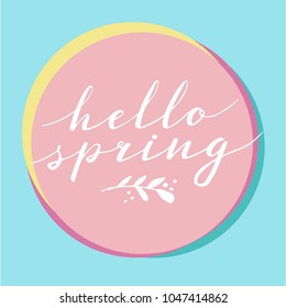 Hello Spring, hand drawn calligraphy and lettering. Design for holiday greeting and seasonal spring holiday card. Blue and pink pastel background